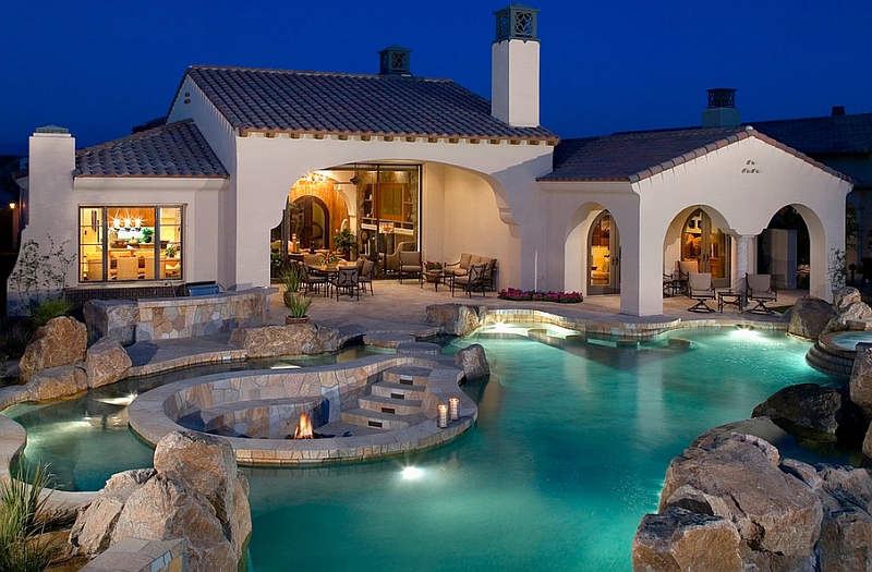 Pool area with a sunken lounge fire pit and a beautifully crafted entry