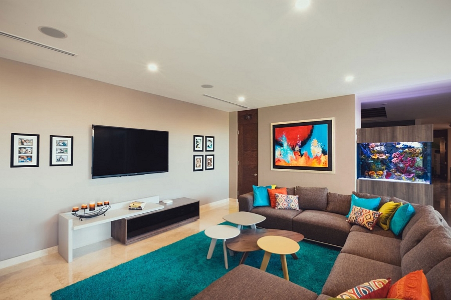 Pops of bright color and the aquarium enliven the family room