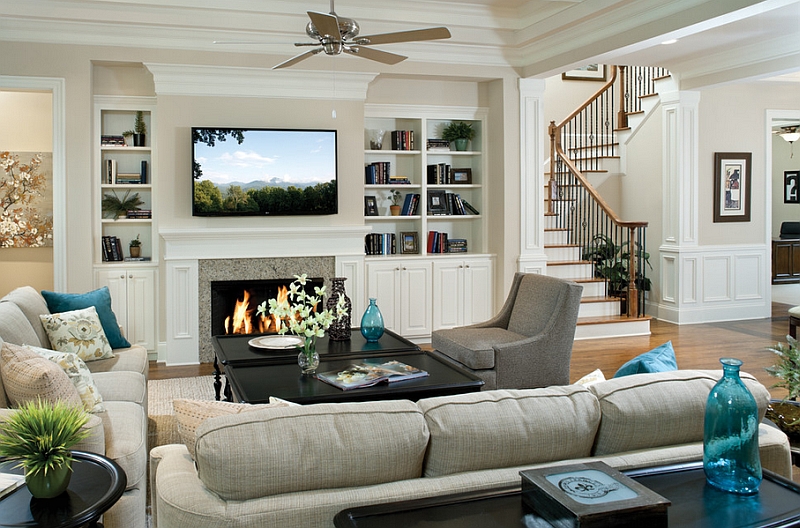 living room with tv over fireplace