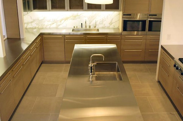 Stainless steel kitchen island with a built-in sink