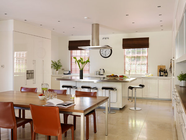 Stainless steel kitchen island with fresh fruit and greenery