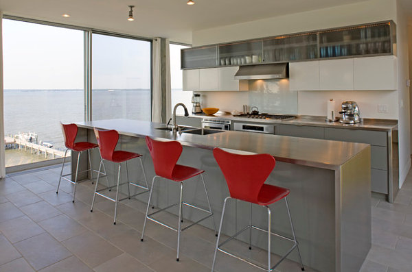 Stainless steel kitchen island with red Series 7 stools