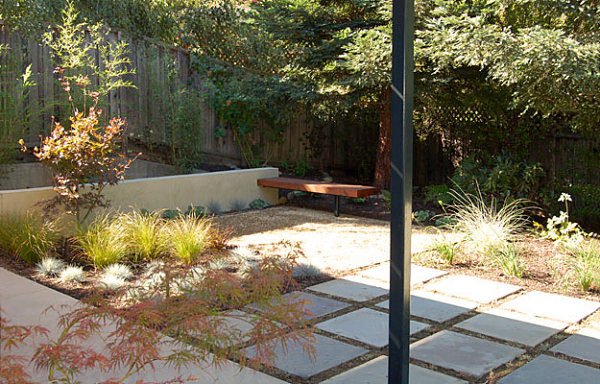 Steel, wood and stone in a backyard space