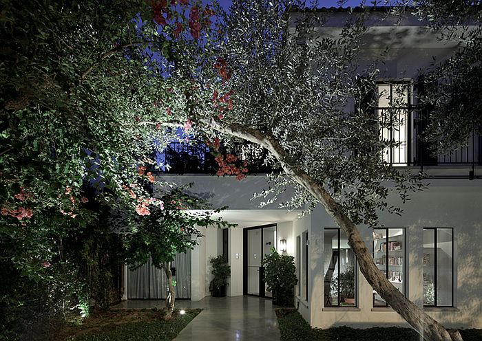 Street facade of the house at night