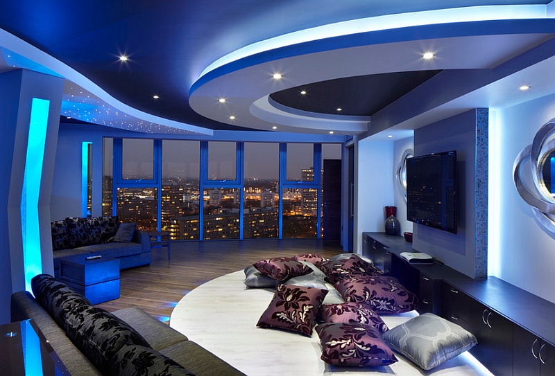 Stunning space with view of London skyline and lighting that adds a blue hue to the room