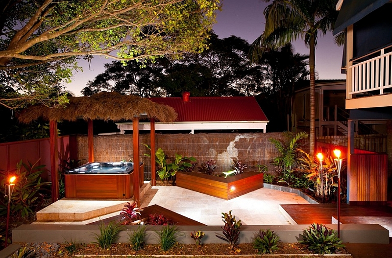 Tiki torches and an outdoor Jacuzzi for an exceptional tropical porch