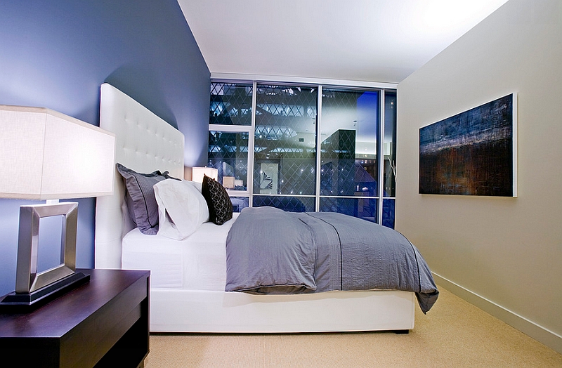 Use lighting to alter the shade of the blue in the bedroom in a subtle fashion