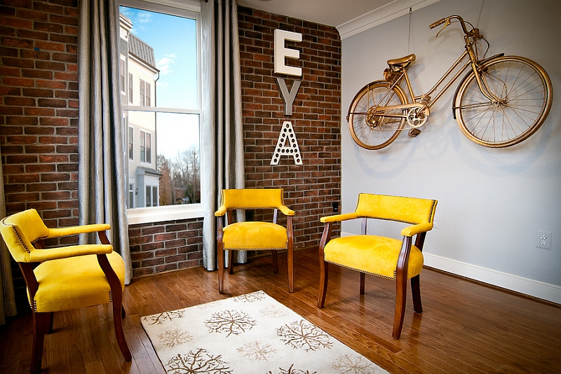 Vintage wall-mounted bike painted in gold for the contemporary living room with a dash of retro