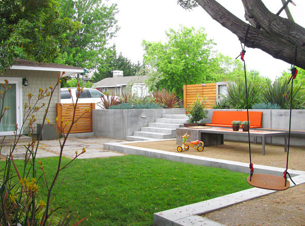 Vivid orange bench in a modern backyard