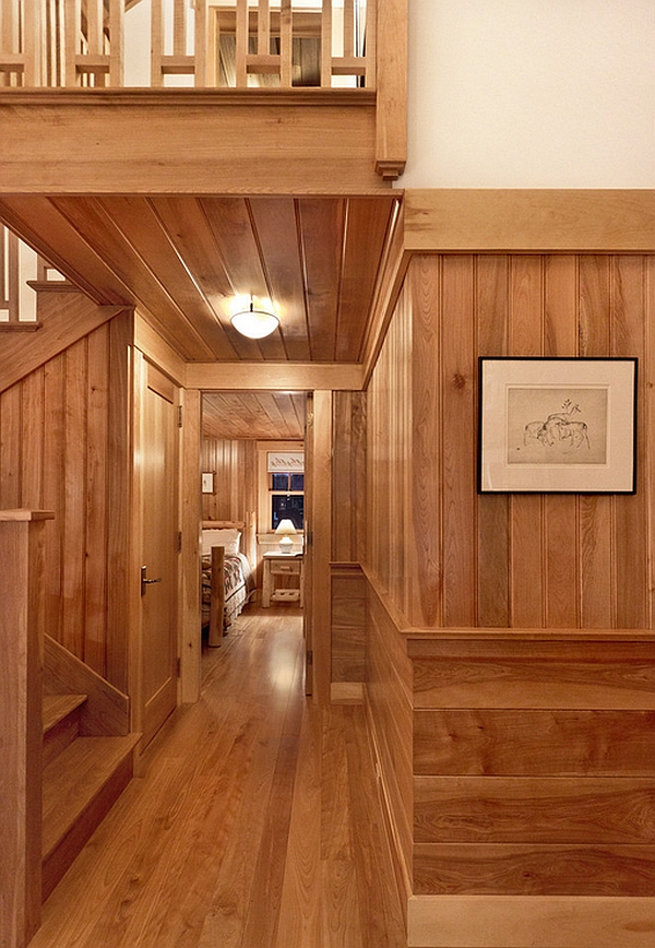 Warm wood paneling in the hallway leading to the bedroom