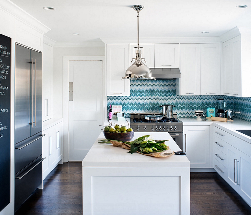 White kitchen with a blue backsplash in vibrant chevron pattern