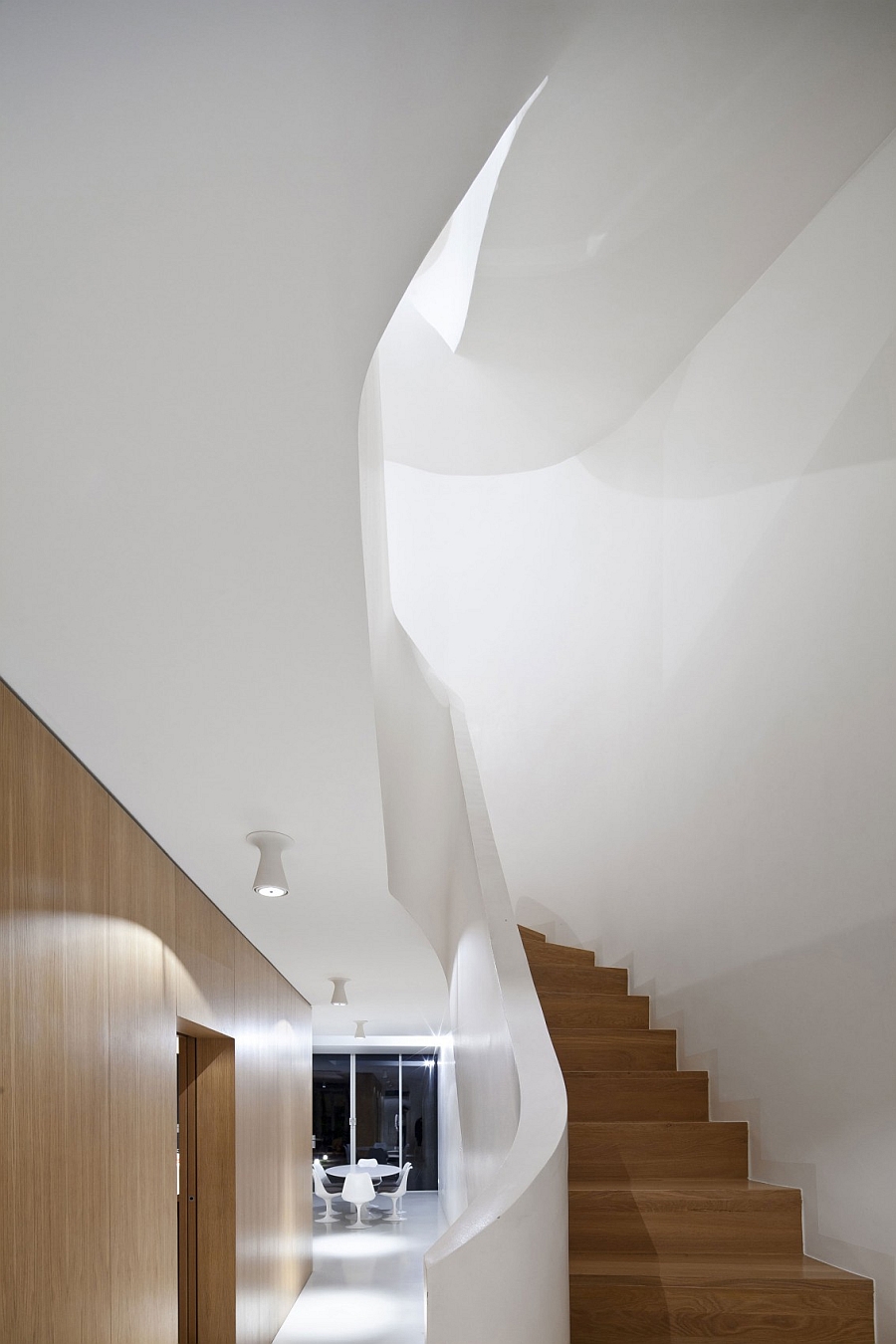 Wooden staircase with unique railing adds to the appeal of the house