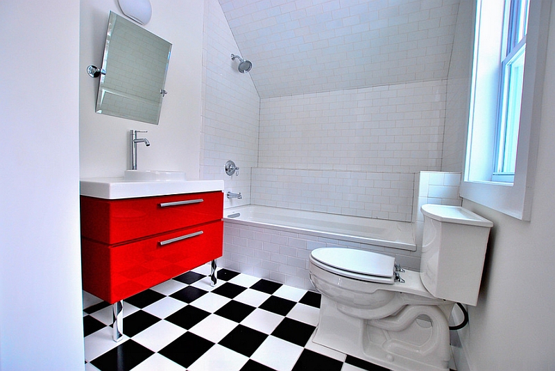 A red vanity in the small bathroom becomes an instant focal point