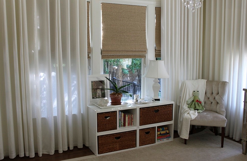 Beautiful Roman shades coupled with some lovely sheer curtains