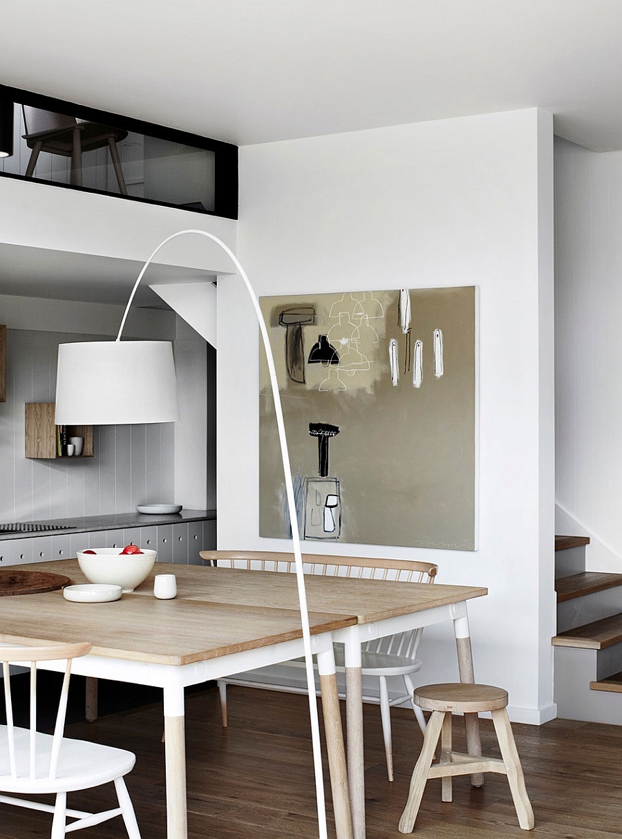 Beautiful floor lamp inspired by the Arco enlivens the dining area