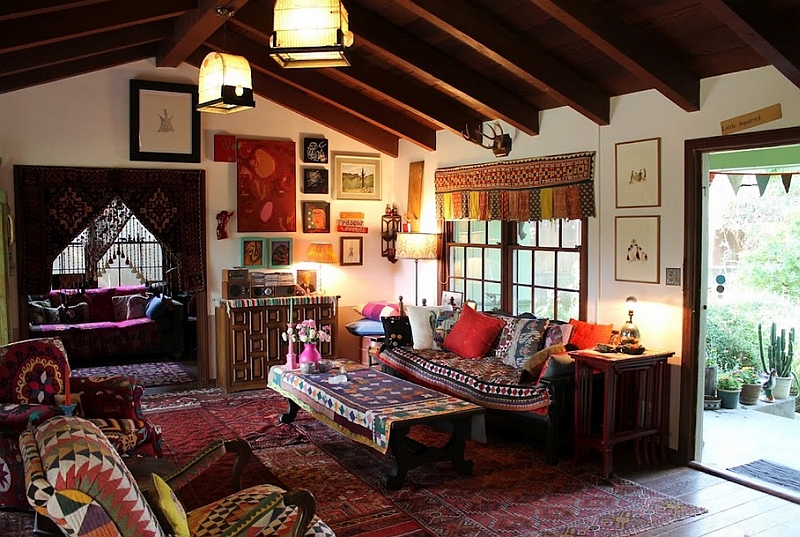 Bohemian living room clad in a wide variety of hues and overlapping rugs