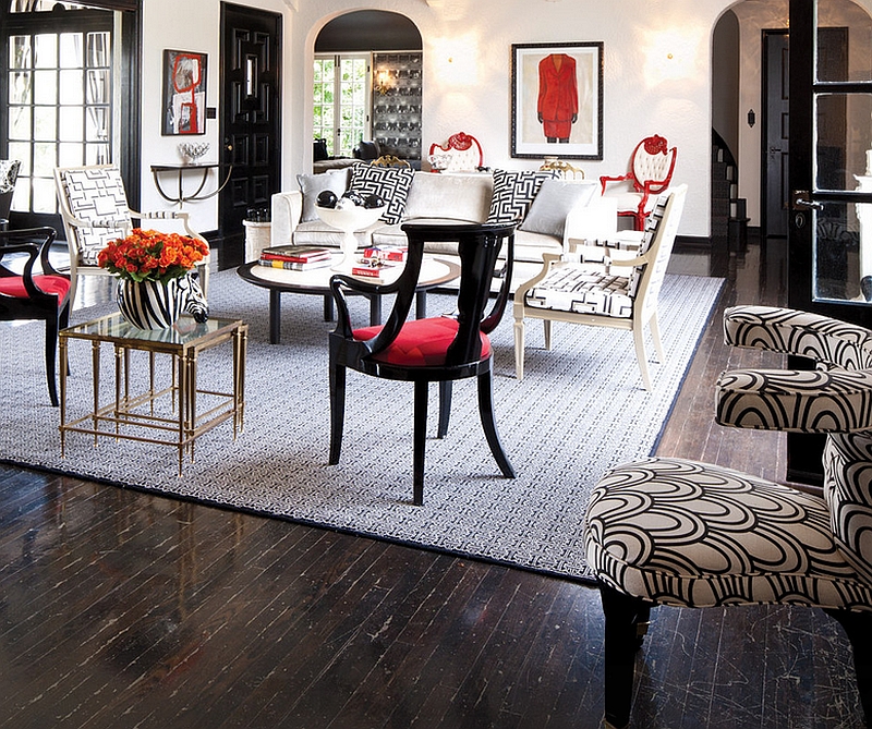 Bold black and red used in a whimsical fashion in the living room along with white