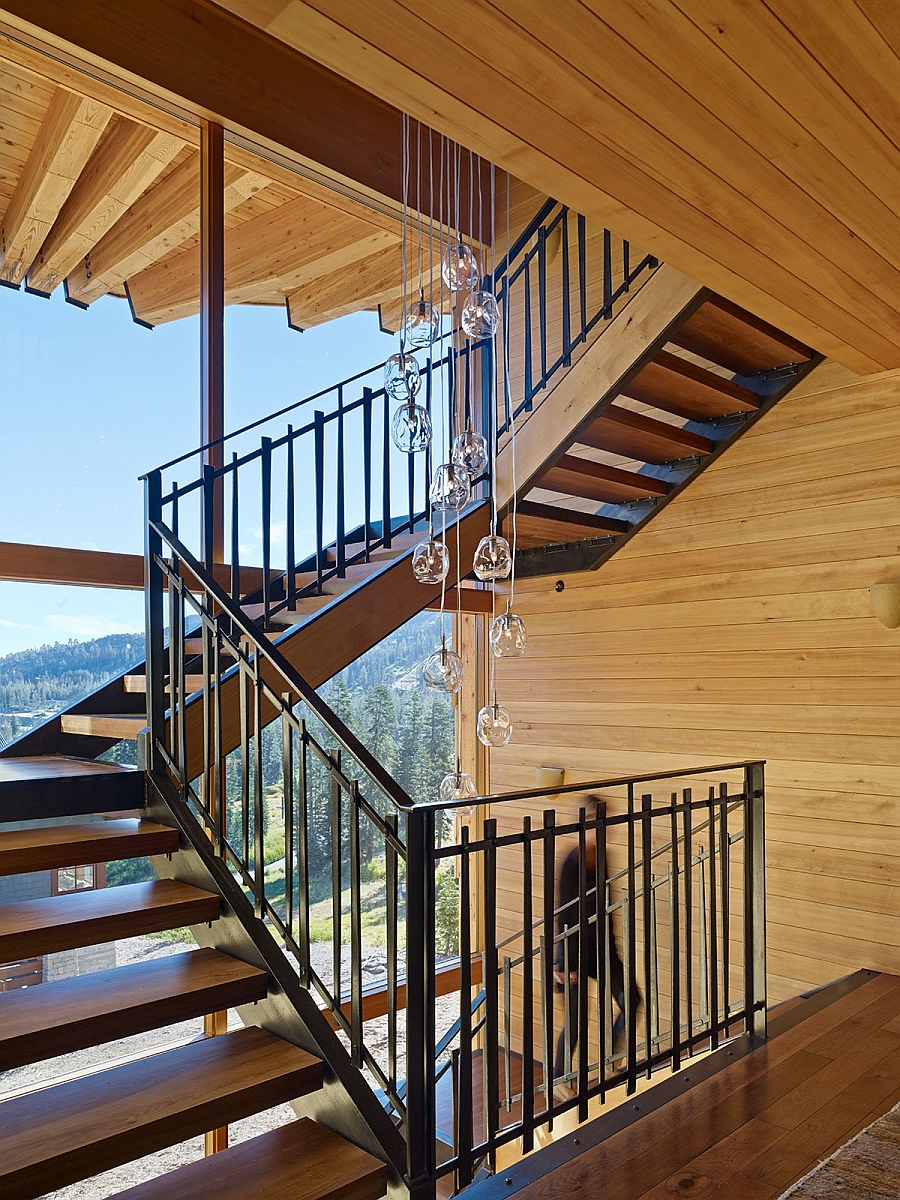 Cascading chandelier lights up the staircase with style