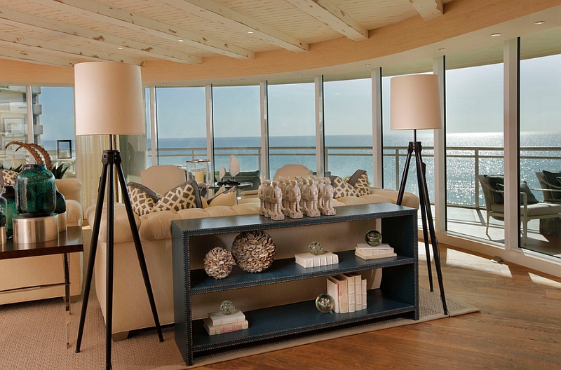 Coastal themed living room with tall tripod floor lamps