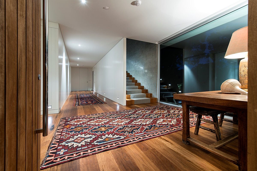 Colorful area rugs enliven the entry