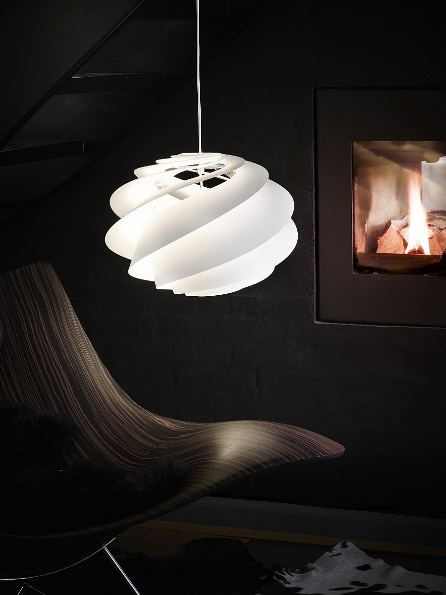 Combine the Swirl pendant with the right seating to create an inimitable redaing nook