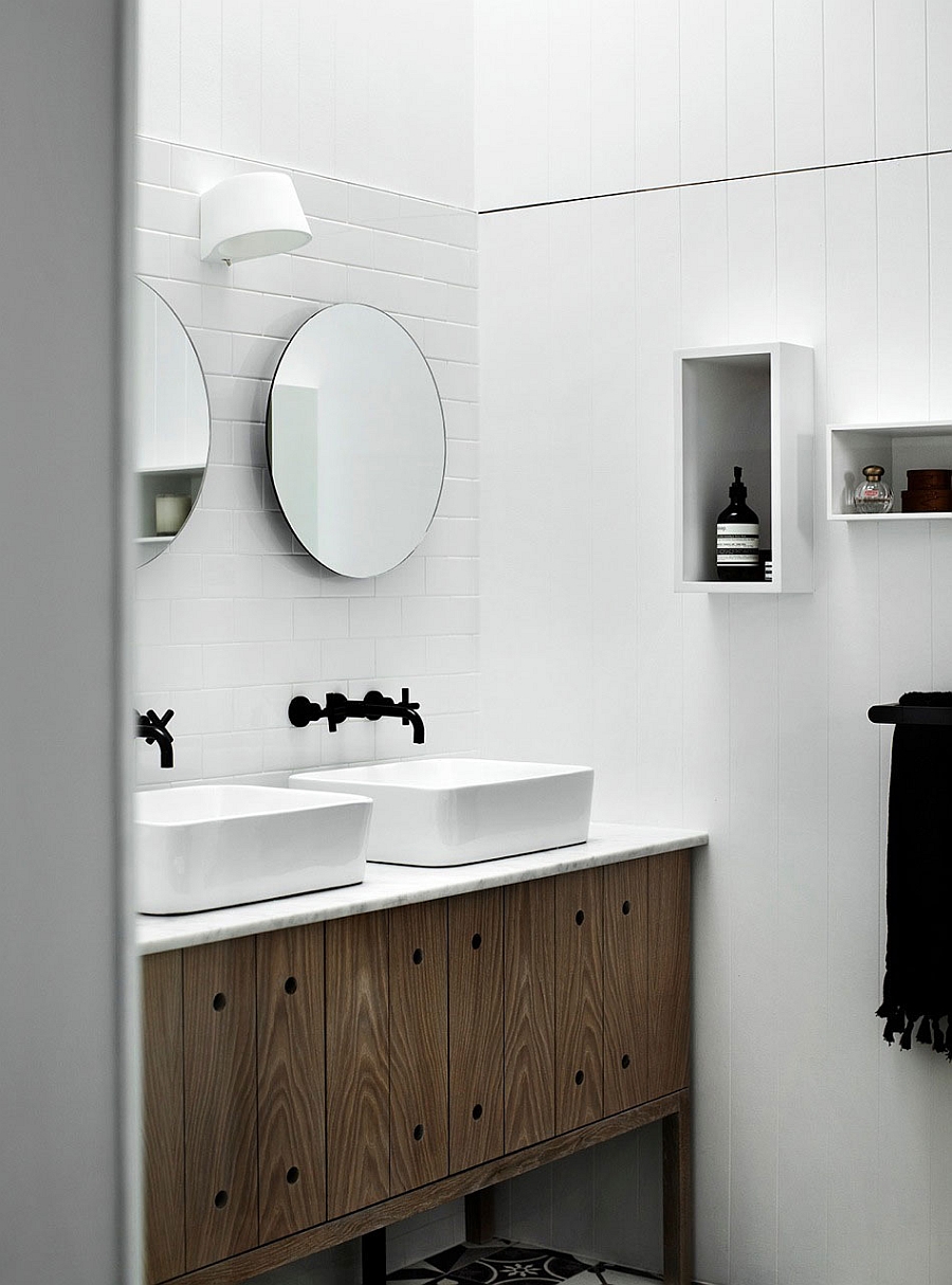 Compact bathroom vanity in wood with stone top and twin sinks