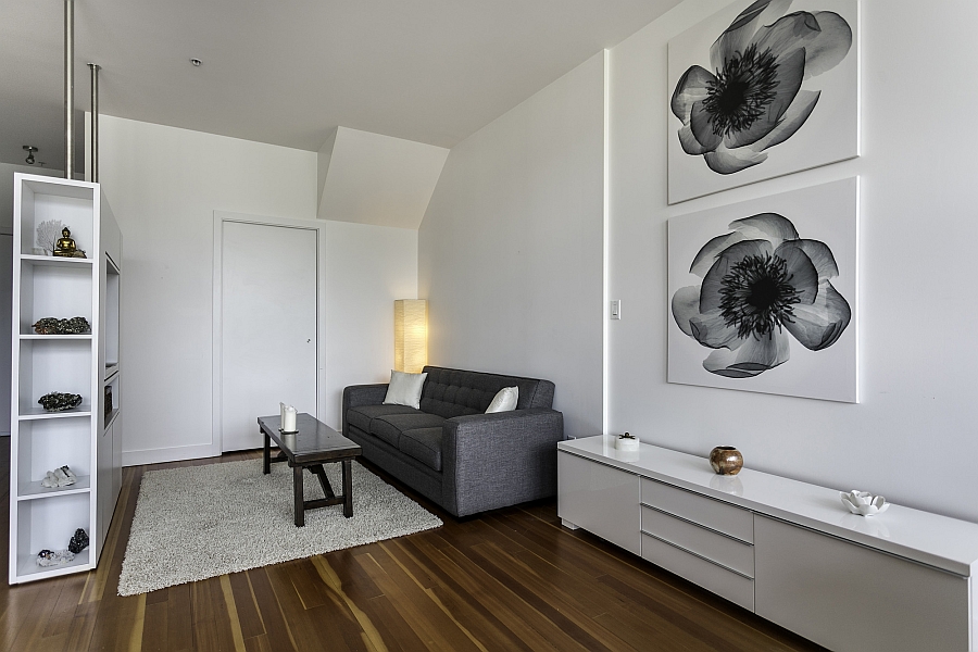 Compact living space in white with wall-mounted entertainment unit