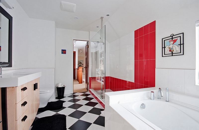 Custom glass shower with bold red tiles stands out visually