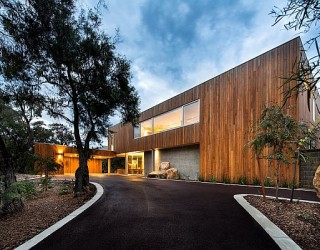 Private Beach House Overlooking The Ocean Amazes With Its Woodsy Silhouette