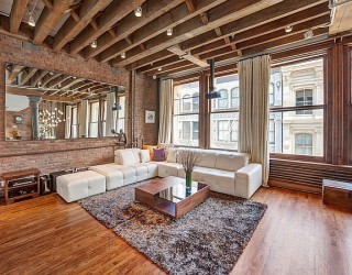 Cozy New York City Loft Enthralls With An Eclectic Interior Wrapped In Brick