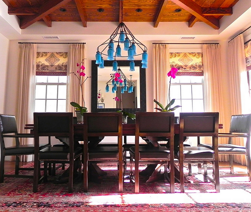 Eclectic dining room combines drapes with roman shades in an elegant manner