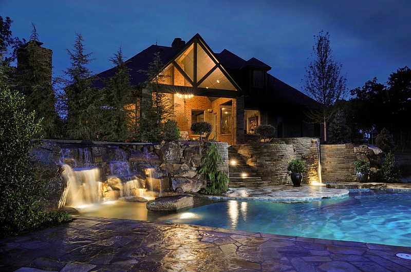 Elaborate swimming pool with multi-level waterfalls and patios