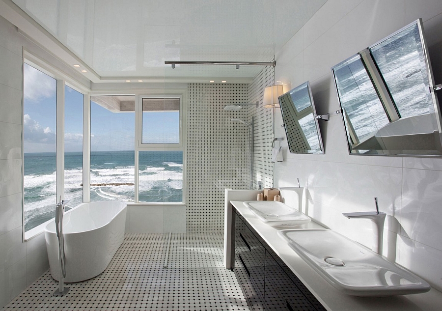 Exquisite contemporary bath in white that seems to be hovering above the ocean!