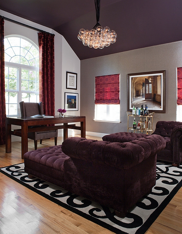 Exquisite home office with red drapes and roman shades