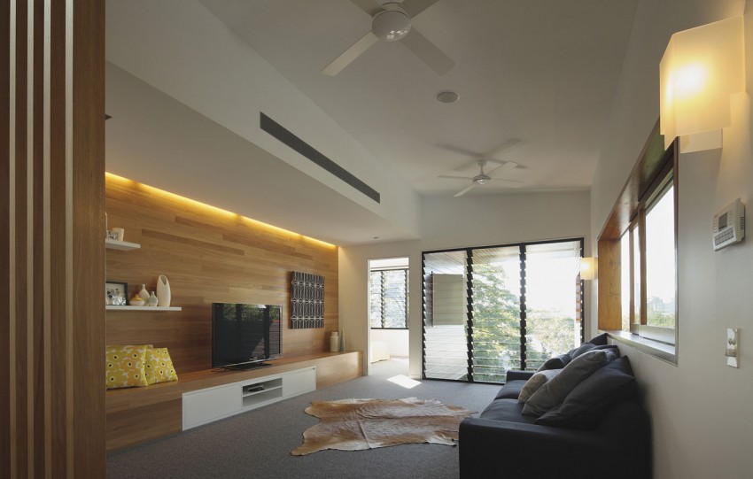 Fabulous family area with a wooden accent wall and plush couch