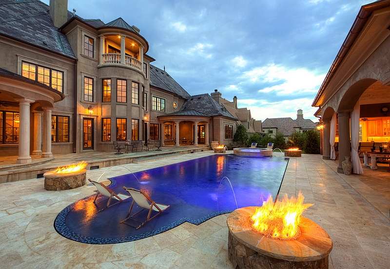 Fire pits at the four corners of the pool enliven the outdoors