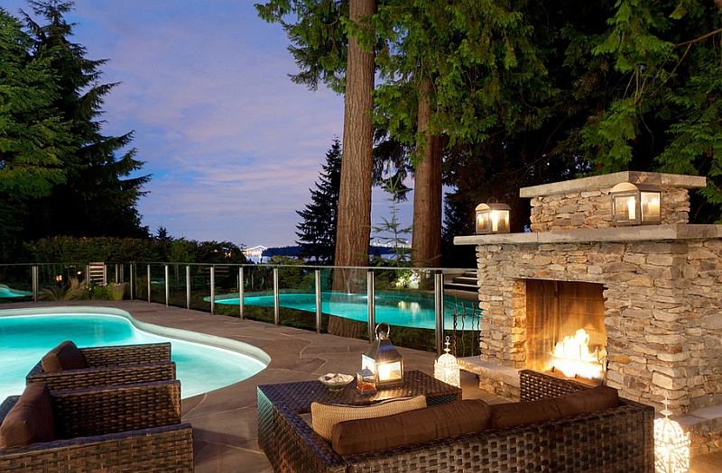 Fireplace next to the pool offers a wonderful focal point for the outdoor lounge