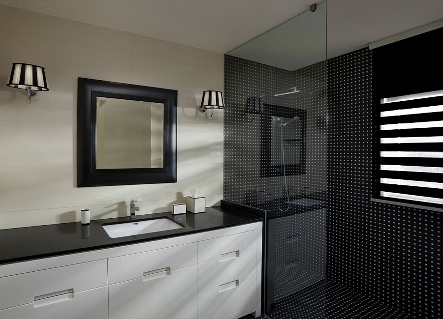 Glass shower area with black tiles is a rarity in modern homes