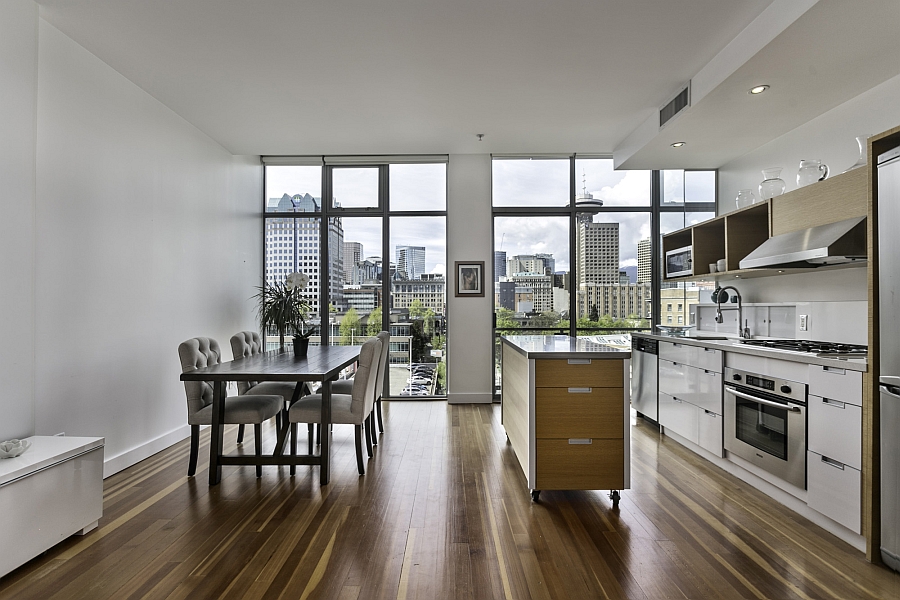 Kitchen and dining space of the modern loft style apartment in Vancouver