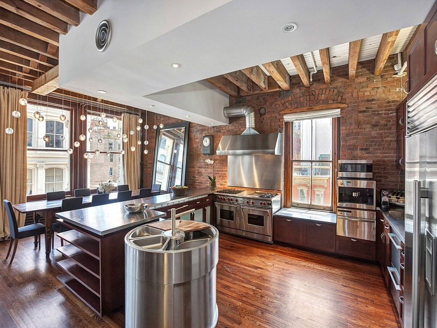 Kitchen With Stainless Steel Surfaces Gives The New York City Apartment An Industrial Appeal 