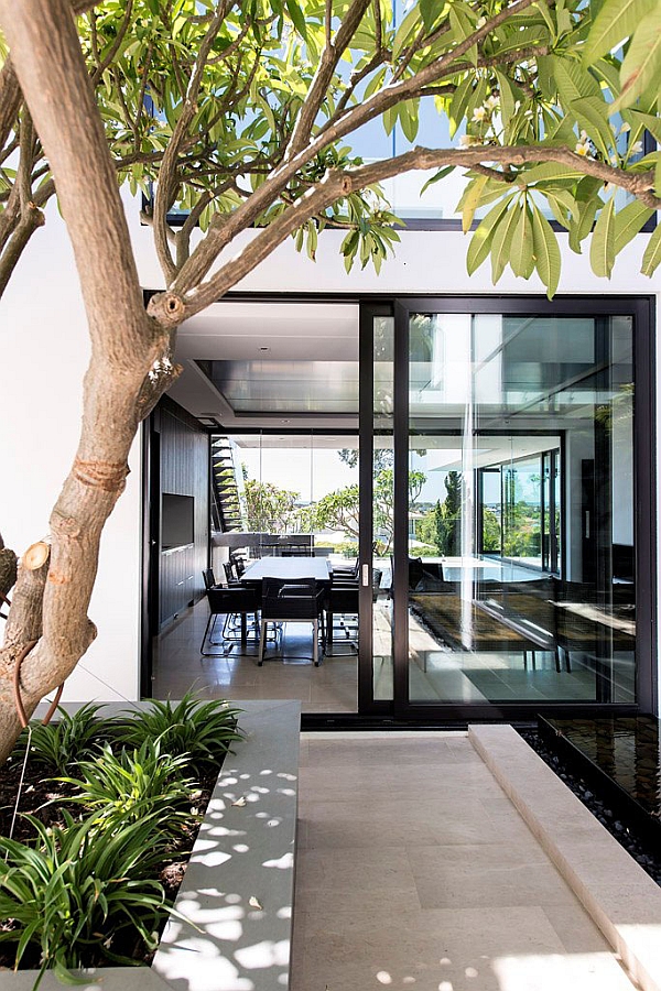 Large sliding glass doors connecting the dining area with the backyard