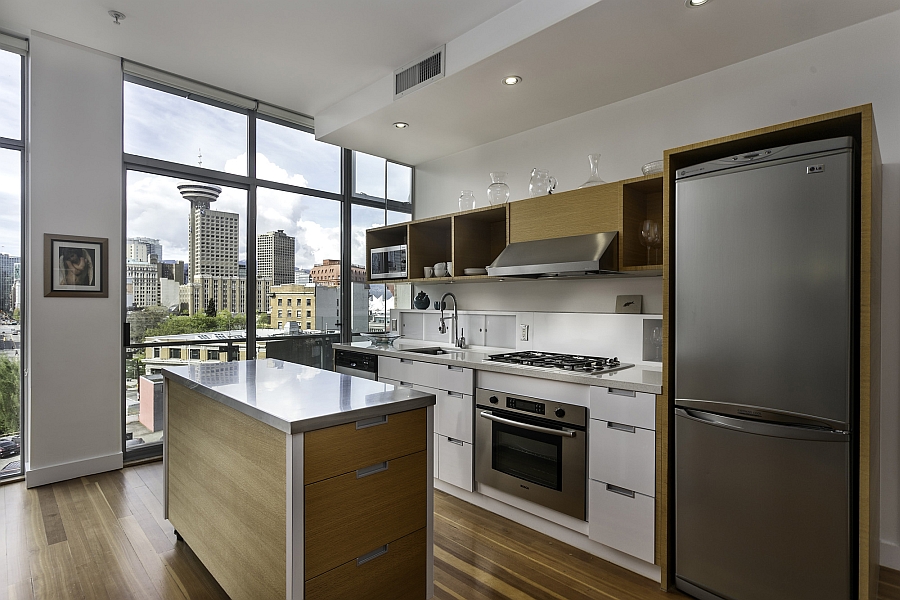 Mobile kitchen island and serving station with a stainless steel top