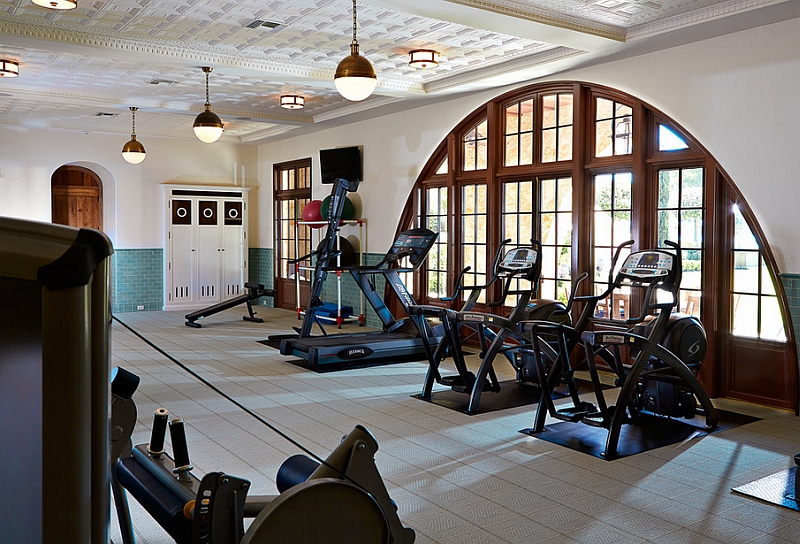 Modern home gym with the Hicks Pendants and stylish recessed lighting