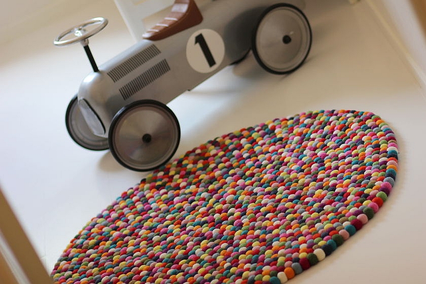 Multi-colored felt ball rug for the playful interior