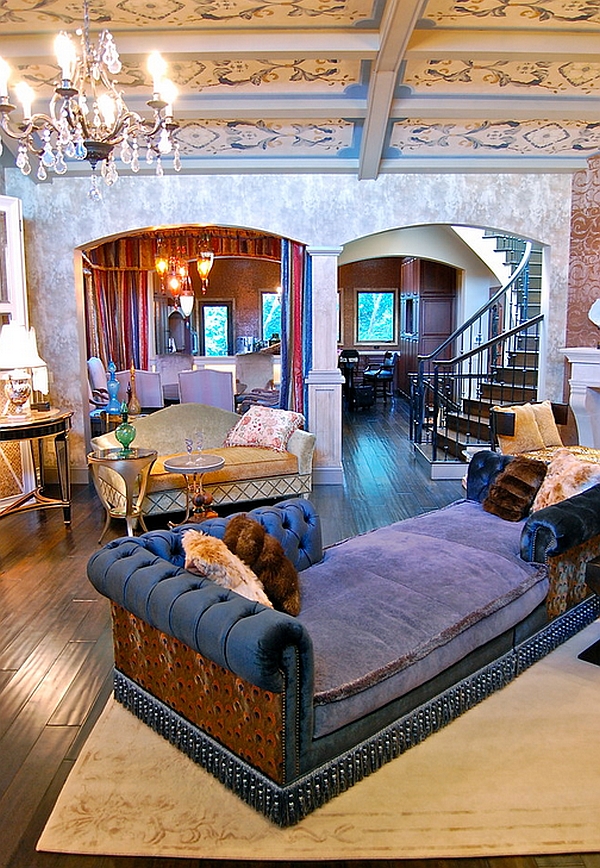 Plush couch in purple steals the show in this Bohemian living room