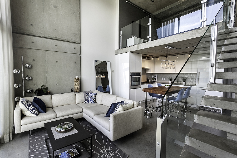 Plush Couch In White In The Living Area With A Exposed Concrete Wall 