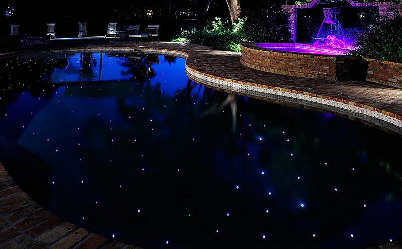 Pool and spa area that mimics the starry night sky using LED lights