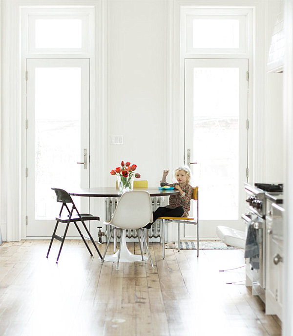 Red tulips in an all-white dining room