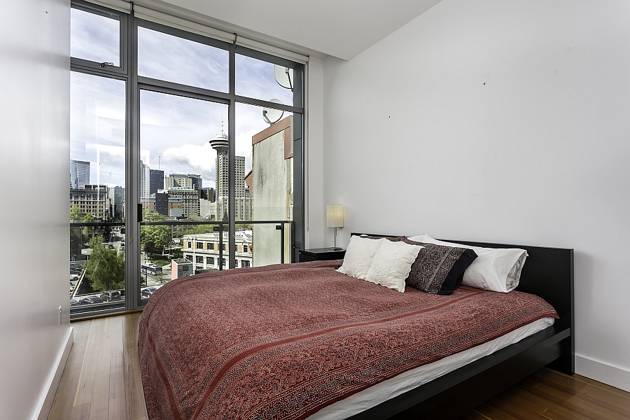 Serene bedroom with unabated views of the Vancouver skyline