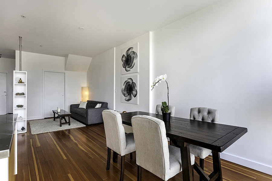 Simple and elegant dining area with a wooden table and plush modern seating